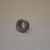 Metal cylindrical part on a flat surface.