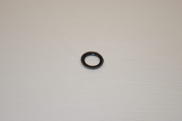 A black ring sitting on top of a white table.