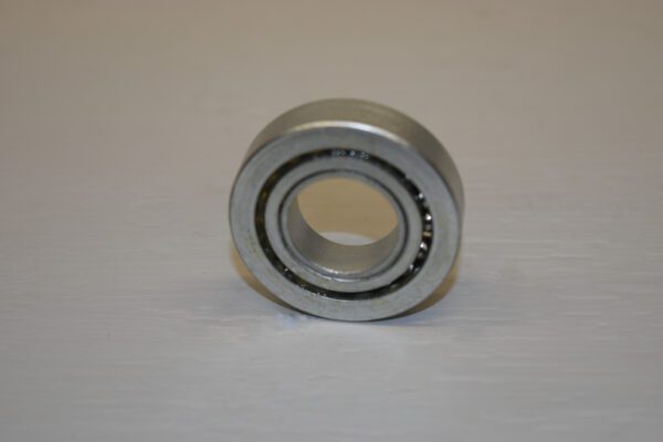 A #1502 Bearing Wheel Horse bearing on a white surface.