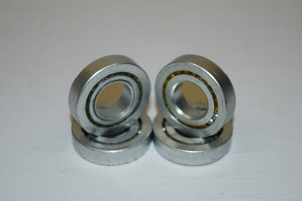 A set of four bearings on top of each other.