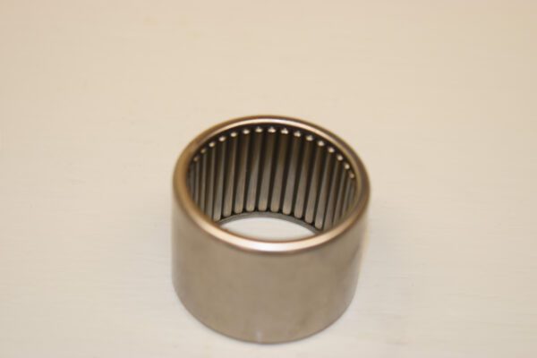 A metal bearing sitting on top of a table.