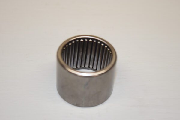 A metal bearing sitting on top of a table.