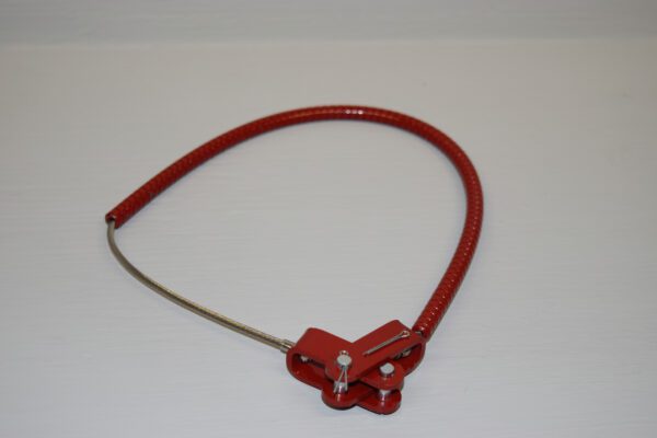 A red wire is connected to a metal piece.