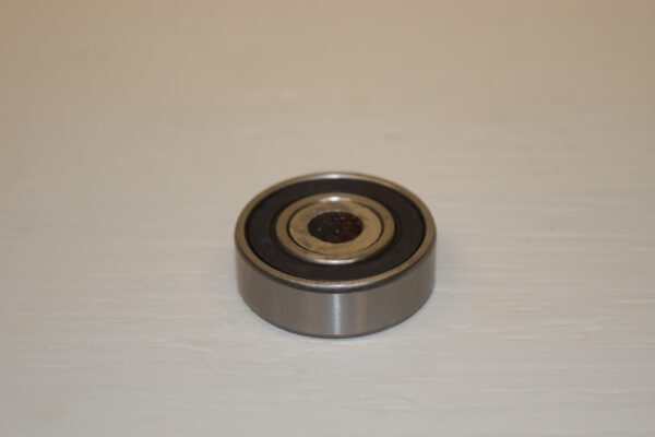 A ball bearing is sitting on the floor.
