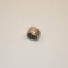 A metal bearing sitting on top of a white surface.