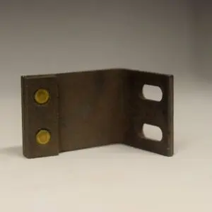 A metal object with two holes and one hole on the side.
