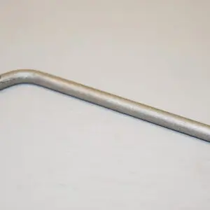 A metal bent handle on top of a table.