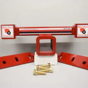 A red trailer hitch with bolts and nuts.