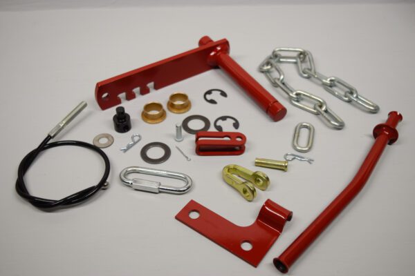 A Toro Wheel Horse Rock Shaft Kit for Manual Transmission with Tube & Bracket - Short Clevis - Read Description with a chain and other accessories.