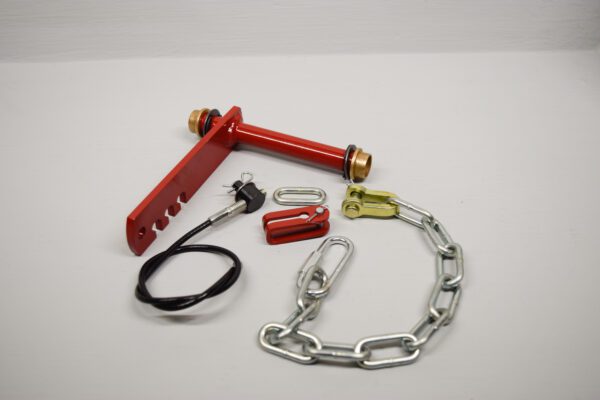A red handle and some chains on top of a table.