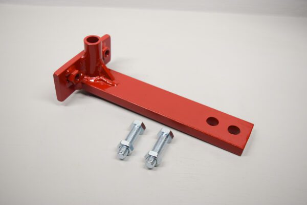A red metal Toro Wheel Horse Slot Hitch Adapter with bolts and screws.