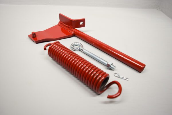 A red handle and a coil spring with a wrench.