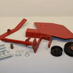 A red metal kit with many parts on top of it.
