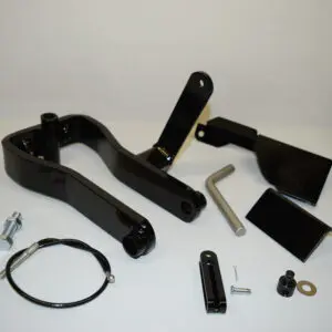A black handle and some parts are laying on the table