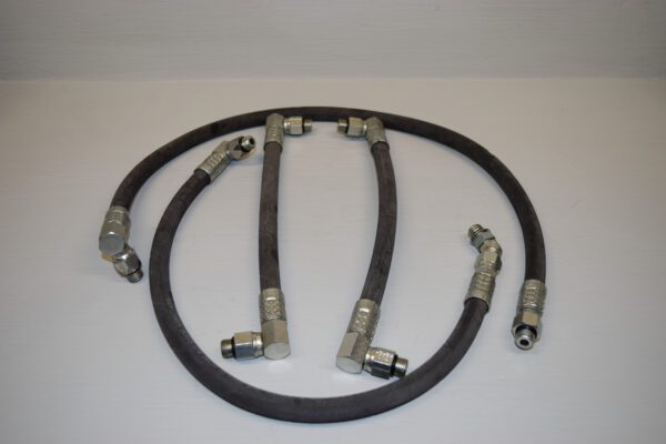 A set of four hoses with different connections.