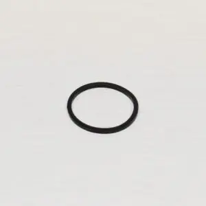 A black ring sitting on top of a white surface.