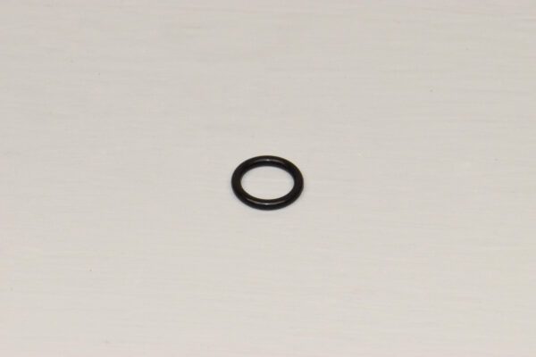 A black ring is sitting on the floor.