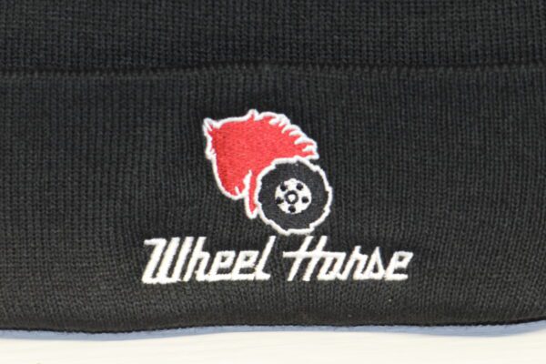 A black beanie with the word wheel horse on it.