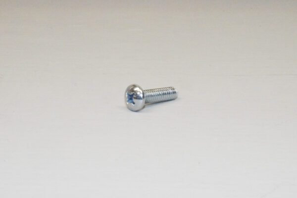 A close up of a screw on a table