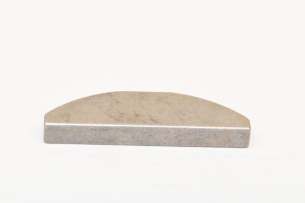 A white marble surface with a curved edge.