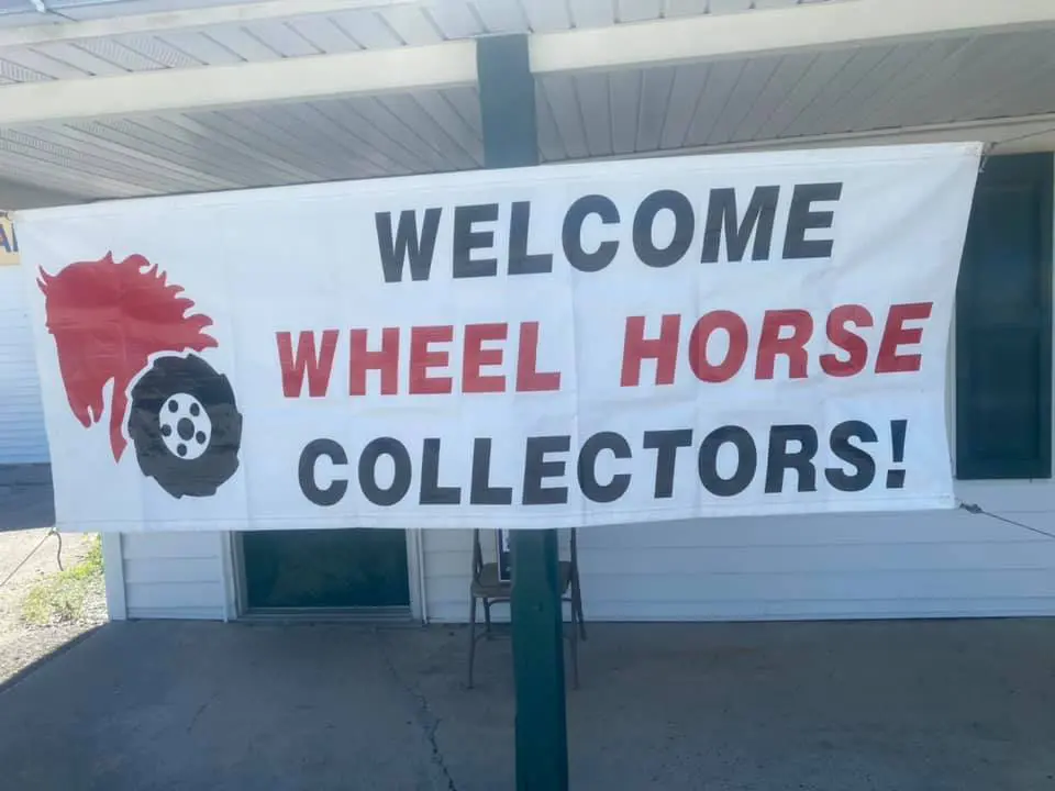 A sign that says welcome wheel horse collectors