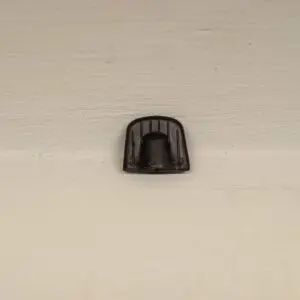 A black object is hanging on the wall.