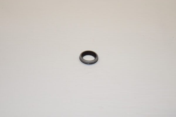 A small black Hein Werner Shaft Seal on a white surface.