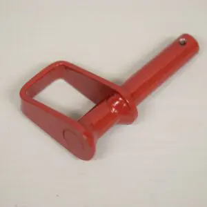 A red handle is sitting on the floor.