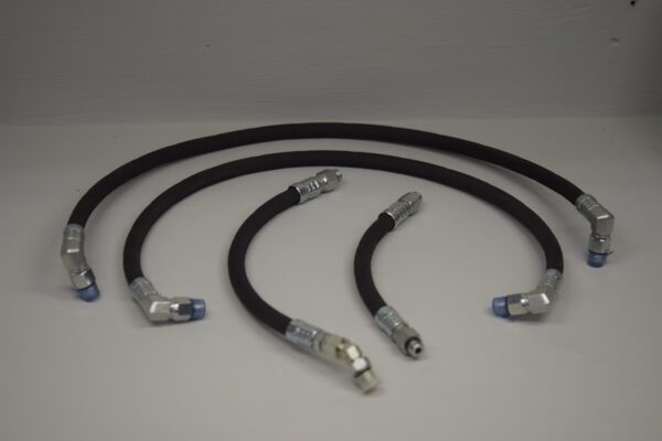 A set of three hoses with an air hose connected to the ends.