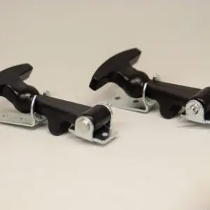 A pair of black handles with metal clips.
