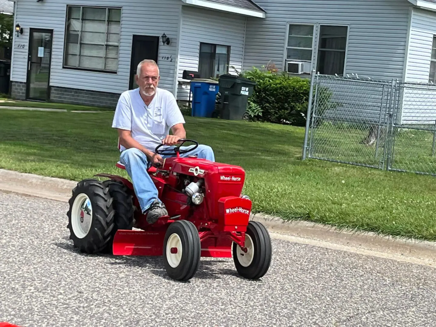 A man driving a tractor