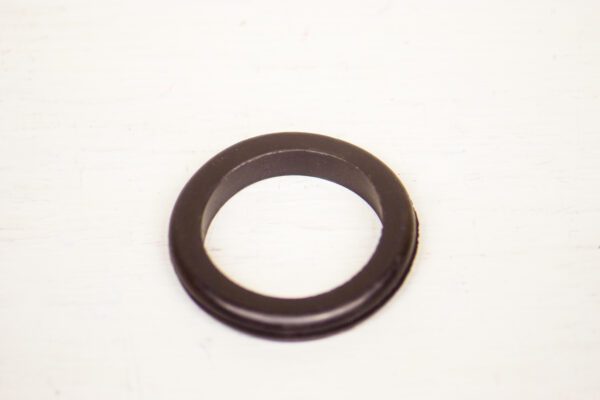 A black rubber ring on a white surface with #2767 Toro Wheel Horse Replacement Hood Gaskets.