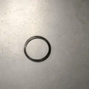 A Backup Ring on a metal surface.
