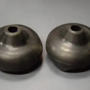 Two #3577 Reproduction Wheel Horse Shifter Boots on a grey surface.