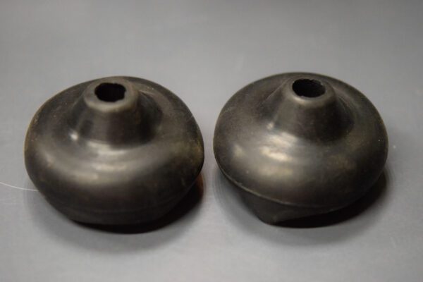 Two #3577 Reproduction Wheel Horse Shifter Boots on a grey surface.