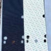 Black and white panels with holes and markings.